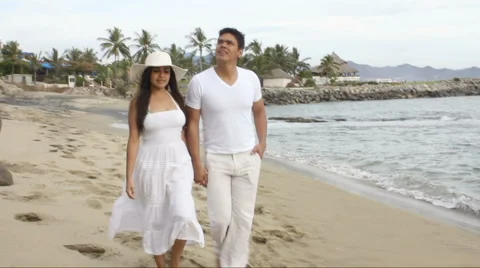 Couple walking on the beach Stock Footage 1092410