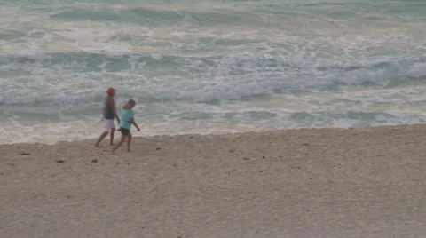 Couple walking at the beach Stock Footage 2856183