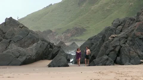 Couple Walking on Beach Stock Footage 20592178