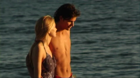 Couple walking on beach Stock Footage 43689021