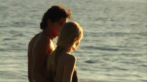 Couple walking on beach Stock Footage 43689044