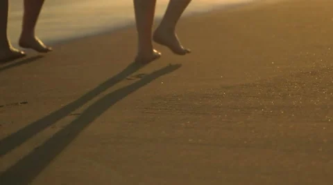 Couple walking on beach Stock Footage 55571258