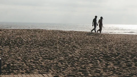 Couple Walking on the Beach Stock Footage 90189821