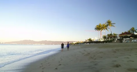 Couple walking on a beach.  Stock Footage 102689721