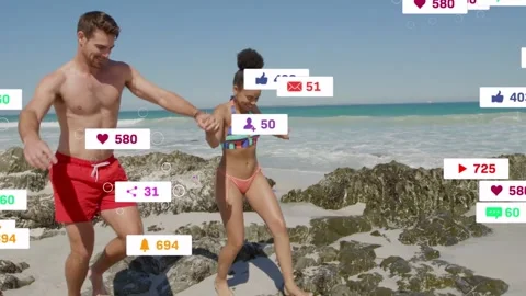 Couple walking beach holding hands as social metrics rising, likes floating then Stock Footage 333154841