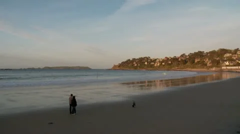 Couple walking on beach - Perros-Guirec, France Stock Footage 10840904