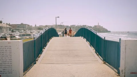 Couple walking on boardwalk Stock Footage 81207914