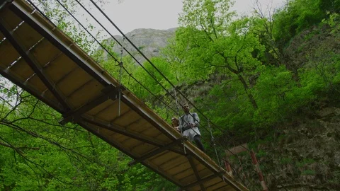 Couple walking on a bridge Stock Footage 99963217