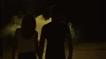 The couple walking in the dark street through the yellow smoke. slow motion 4k or 4k+ Resolution