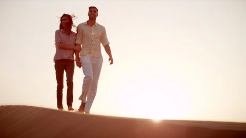 Couple walking on desert. Stock Footage 119388428