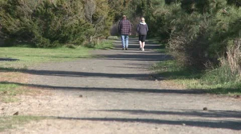 A couple walking down a hiking path (2 of 2) Stock Footage 10774992