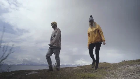 Couple walking down the mountain slope Stock Footage 85829817