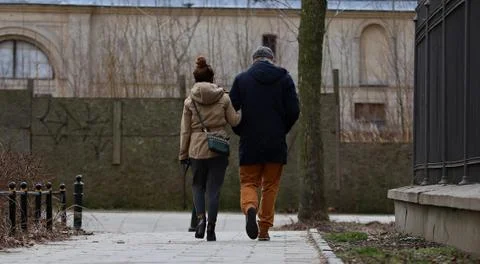 Couple walking down the sidewalk Stock Photos