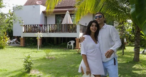 Couple Walking Embracing In Tropical Garden Near Villa House, Happy Man And Stock Footage