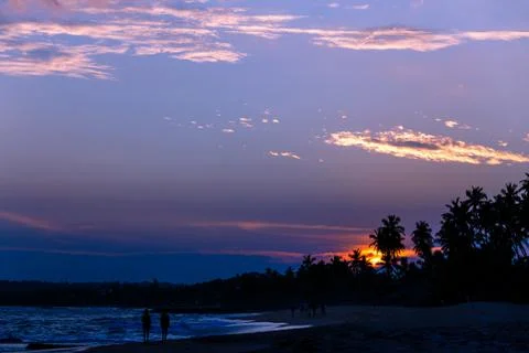 Couple walking evening beach Stock Photos