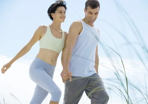 Couple walking in exercise clothes Fotos de archivo