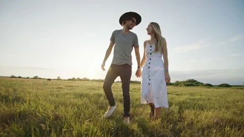 Couple walking in field during date Video stock 219954321