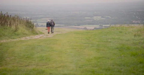Couple walking in field Stock Footage 59899669