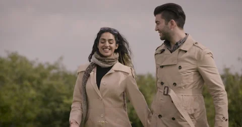 Couple walking in field Stock Footage 59899899