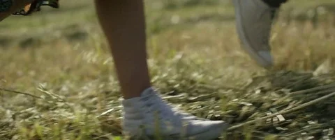 Couple walking in the field in slow motion Stock Footage 69201847