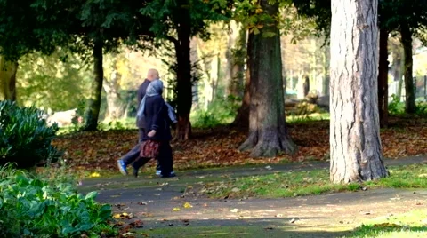 A couple walking on a footpath in the park Video stock 43978311