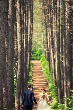 Couple walking in the forest Stock Photos