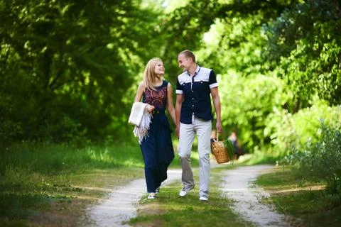 Couple walking in forest Stock Photos