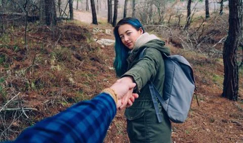 Couple walking in the forest Stock Photos