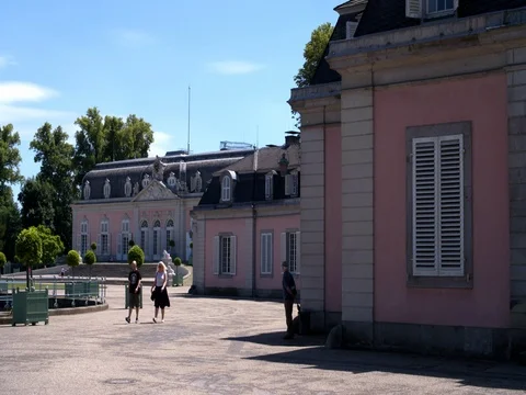 Couple walking in front of Benrath Palace, Schloss Benrath, Düsseldorf Stock Footage 77189091