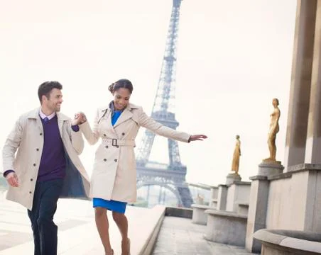 Couple walking in front of Eiffel Tower, Paris, France Stock Photos