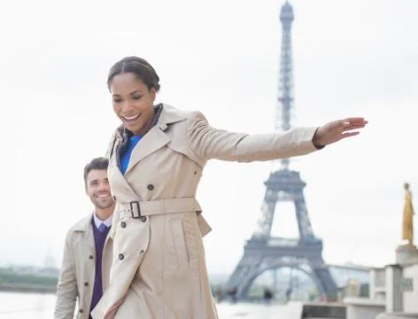 Couple walking in front of Eiffel Tower, Paris, France Stock Photos