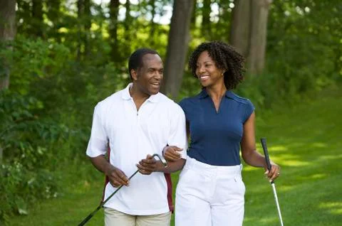 Couple Walking on Golf Course Fotos Stock