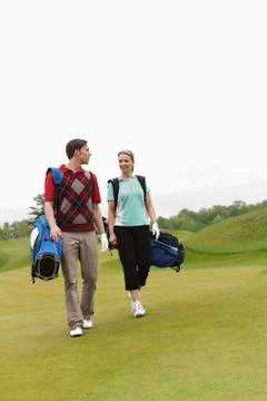 Couple Walking on Golf Course Fotos Stock