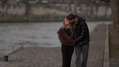 Couple Walking Hand-in-Hand Along Seine River Embankment in Paris France Stock Footage 325242360