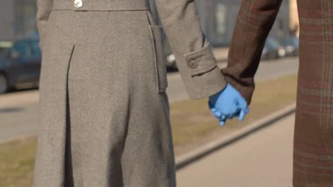 Couple walking hand by hand Stock Footage 127269956