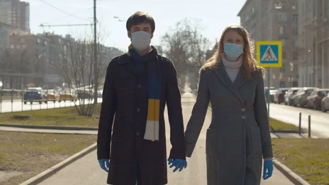Couple walking hand by hand Stock Footage 127296126