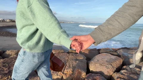 Couple walking hand in hand Stock Footage 261672264