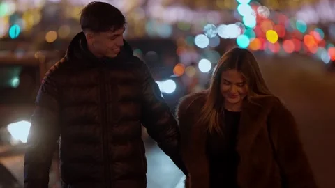 Couple Walking Hand-in-Hand at Night in Paris France Romantic stroll along city Stock Footage 328568593