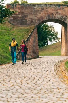 Couple walking hand in hand Stock Photos