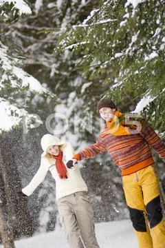 Couple Walking Hand In Hand, Smiling