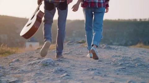 Couple walking holding hands Stock Footage 75258304
