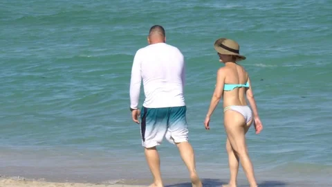 Couple Walking in Miami Beach Stock Footage 75324936
