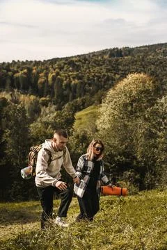 Couple walking in mountain forest Stock Photos