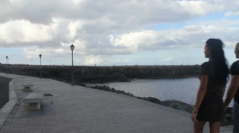 Couple walking by the ocean Stock Footage 37485181