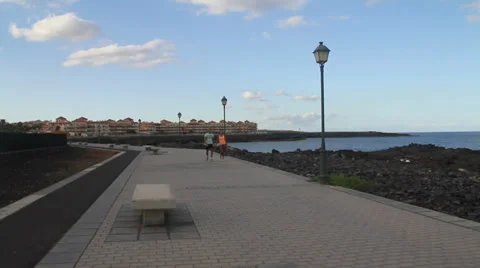 Couple walking by the ocean Stock Footage 39137196
