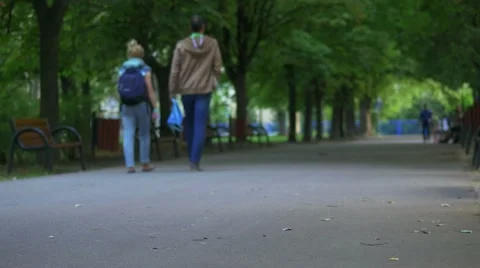 Couple walking in the park. Video stock 66366160