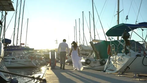 Couple walking on pier Stock Footage 81043585