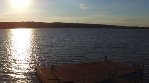 Couple walking on the pier at sunset. Shooting with quadrocopters. Dron. dji Stock Footage 67485104