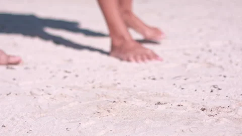 Couple walking in the sand Stock Footage 138459676