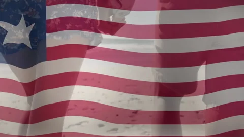 Couple walking sand under transparent flag overlay brushing fingertips clasping 스톡 동영상 313703702